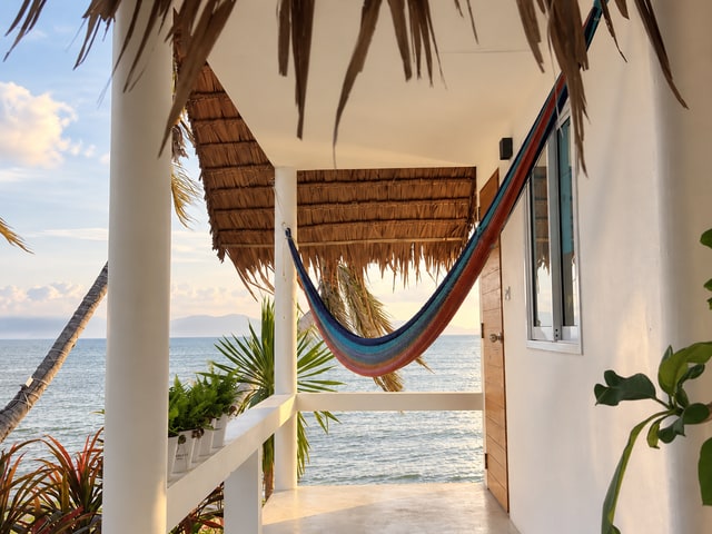 Beachfront bungalow hammock terrace looking directly onto the sea
